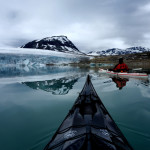 Kristoffer Vandbakk in a white kayak at Styggevatnet glacial lake